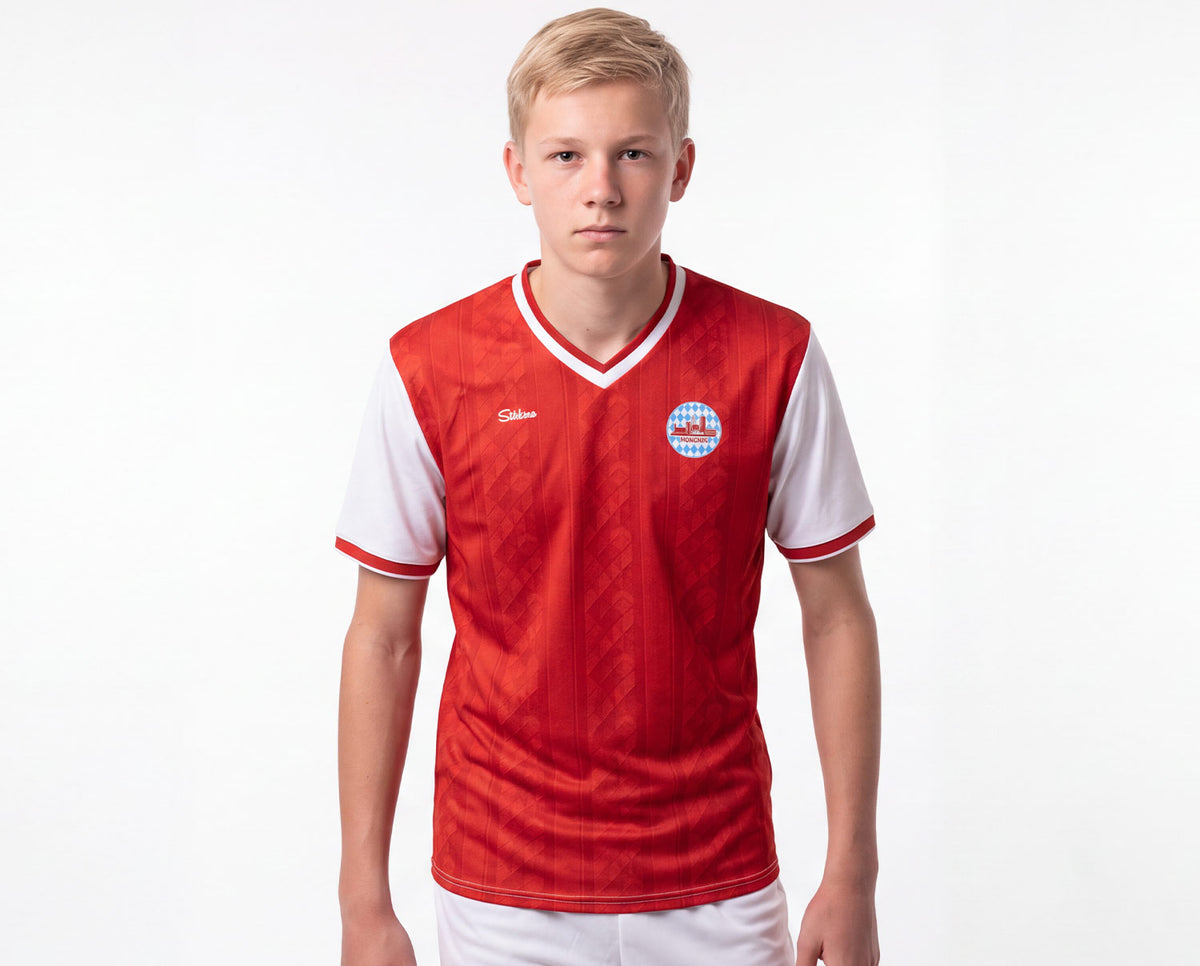 München Fan-Trikot Kids 26/27 Heim "Unser Herz schlägt Rot" inkl. Name und Nummer (Druck)